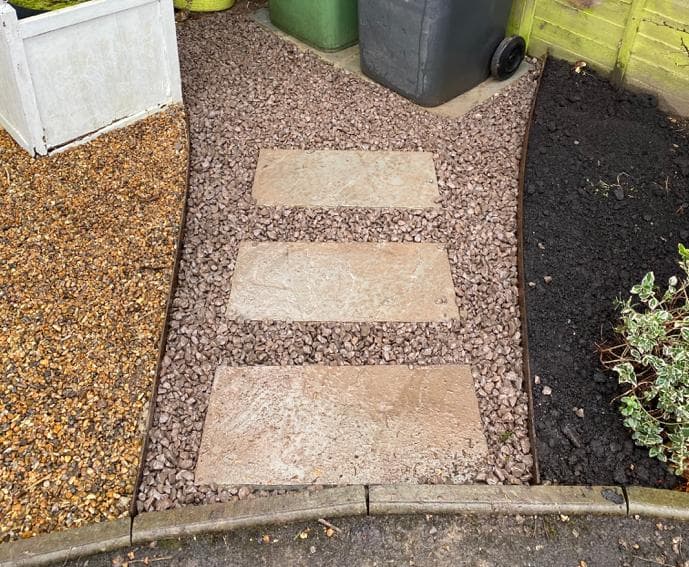 Gravel paths with metal dividing structures, and inset paving